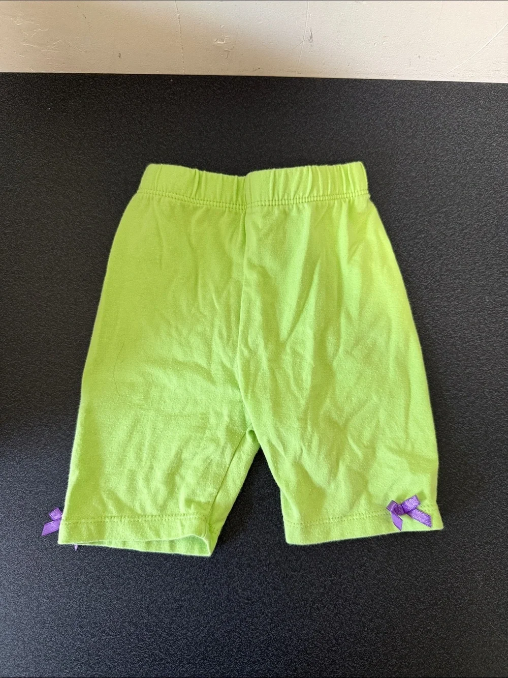 Kids Lime Green Stretch Short Leggings with Purple Bow Accents dated 2014 Y2K